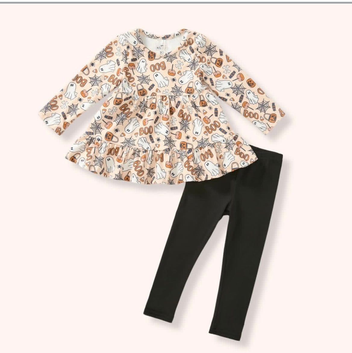 Cream Halloween-print peplum top with ghosts, pumpkins and spiderwebs, paired with black pants