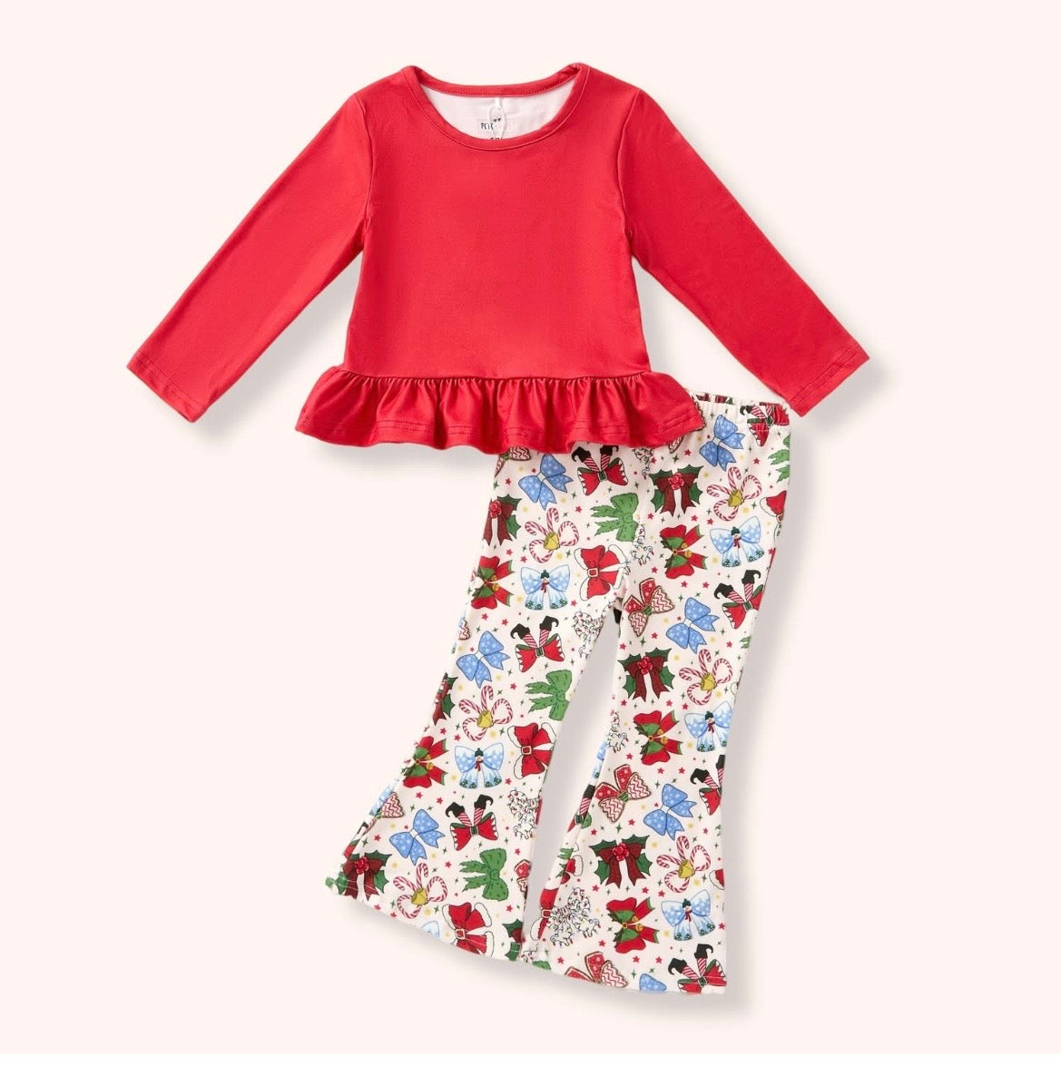 Christmas Bows two-piece pant set with a red long-sleeve ruffle-hem top and light-colored flare pants printed with colorful holiday bows.