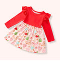 Christmas Cookies Dress with red long sleeves, ruffled shoulders, and a light pink skirt printed with gingerbread cookies and peppermint treats.